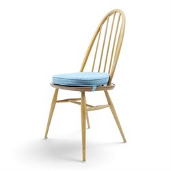Ercol - set of four 'Quaker' dining chairs, with high hooped back, blue seat cushions with studded, tapered supports  