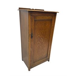Early 20th century oak cupboard, enclosed by single panelled door