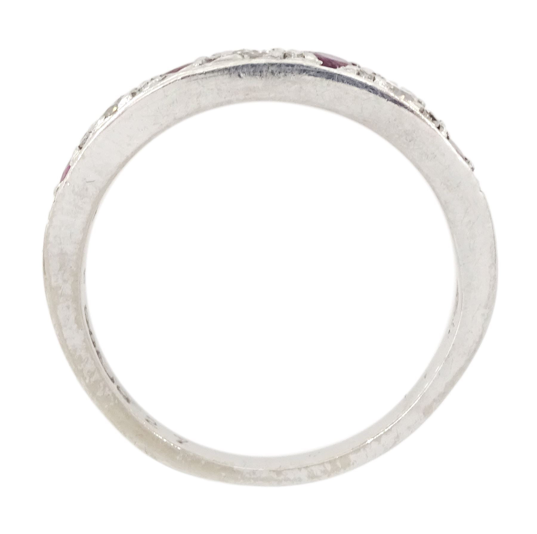 18ct white gold ruby and round brilliant cut diamond half eternity ring, London 1978