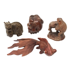 Three Japanese Meiji carved wooden netsukes, comprising dragon, skull with snake, and two frogs on lily pad, together with a carved wooden model of a fighting fish, L10cm, (4)  