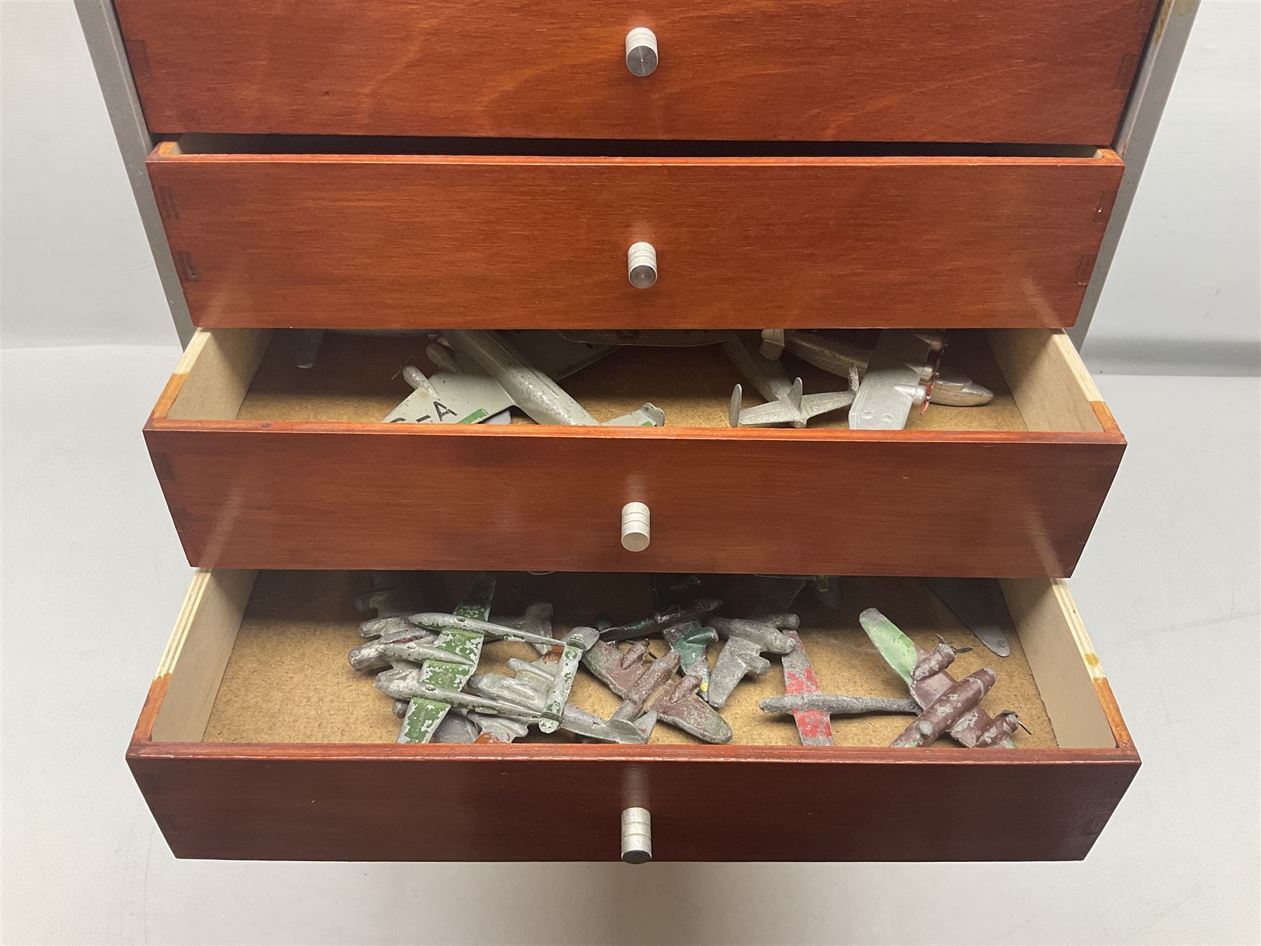 Tabletop chest with nine drawers, with Dinky toy and other die-cast model parts, drawers H62cm