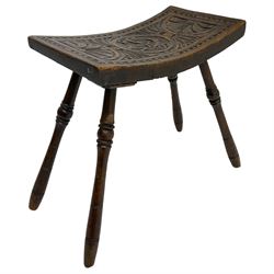 Late 19th century oak stool, rectangular dished top relief carved with floral lunettes and central insignia, on turned splayed supports