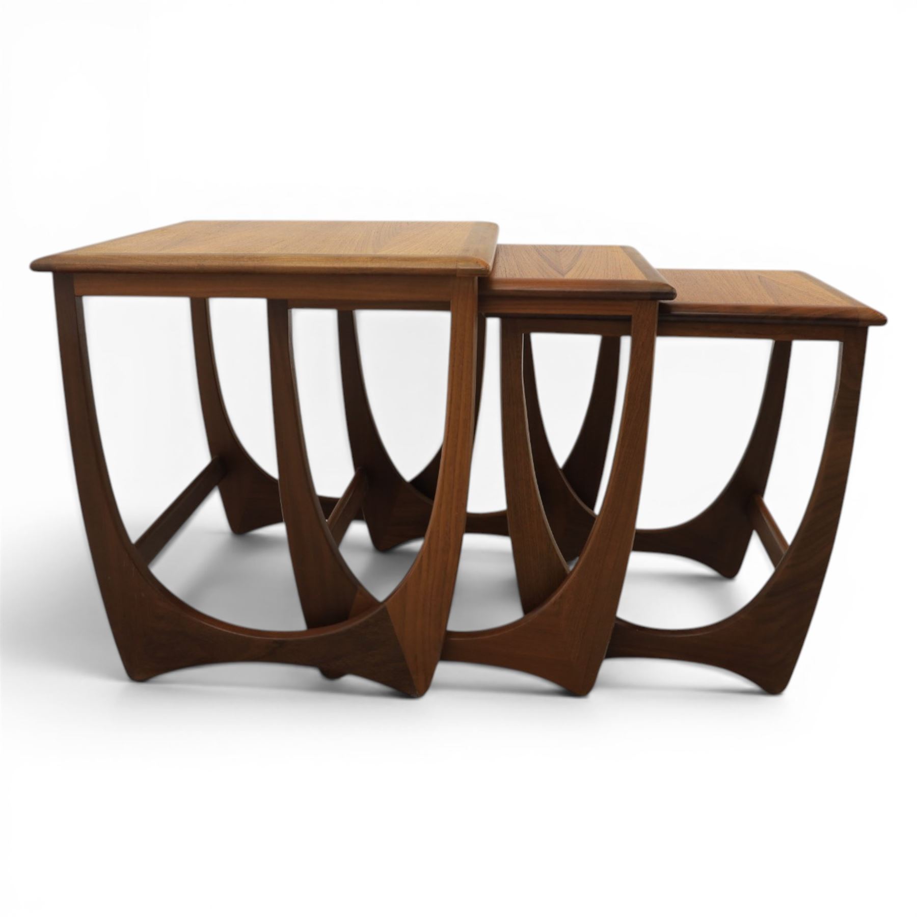 G-Plan - 'Astro' teak nest of three tables, square top with shaped supports