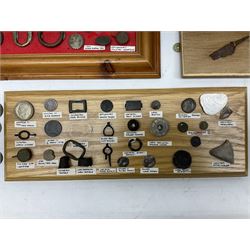 Collection of metal detecting finds and antiquities, housed on five display boards and some loose, to include coins, keys, axe head etc 