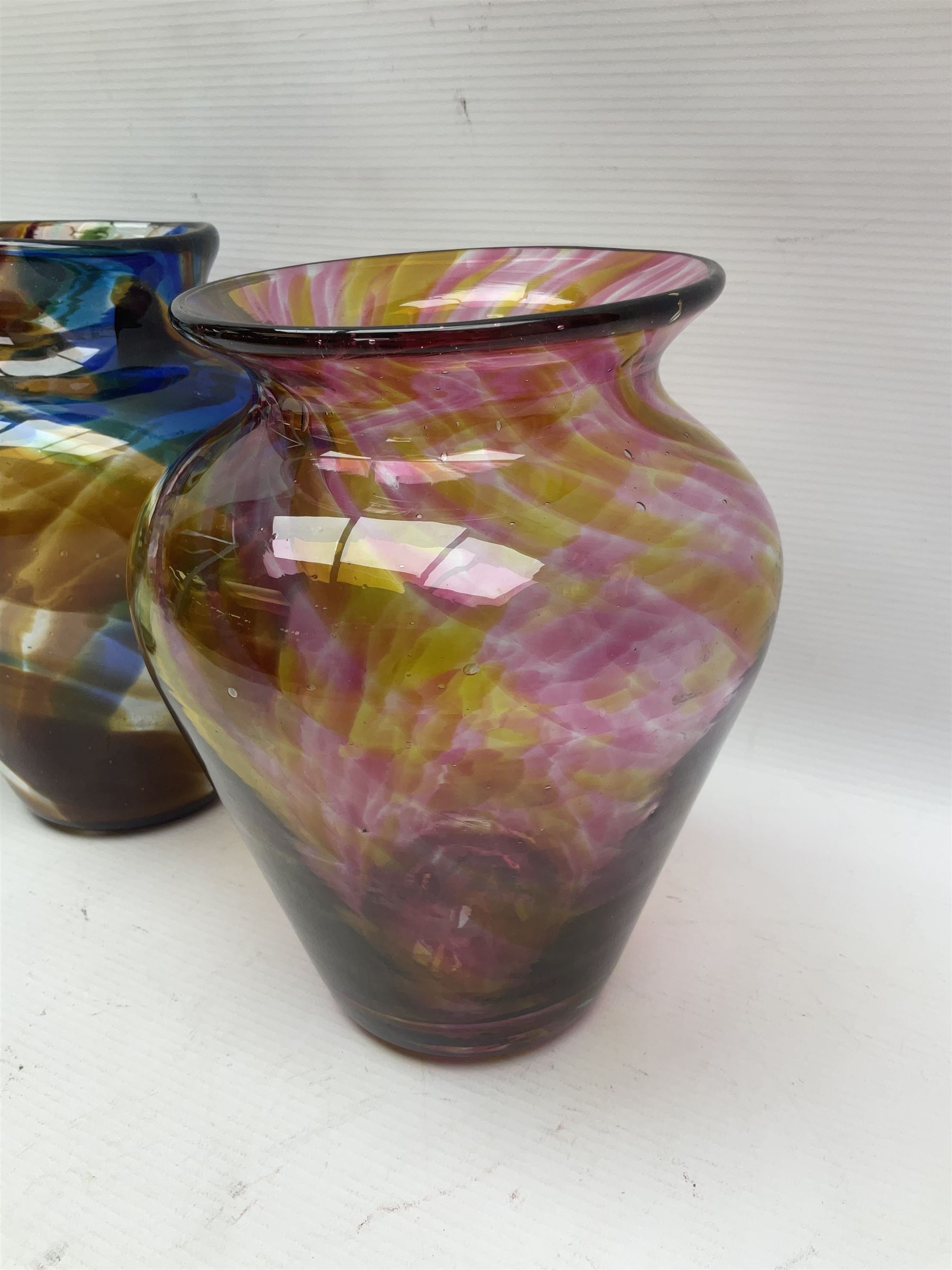 Three Hartley Wood coloured glass vases, each of baluster form with swirling decoration, tallest H21cm