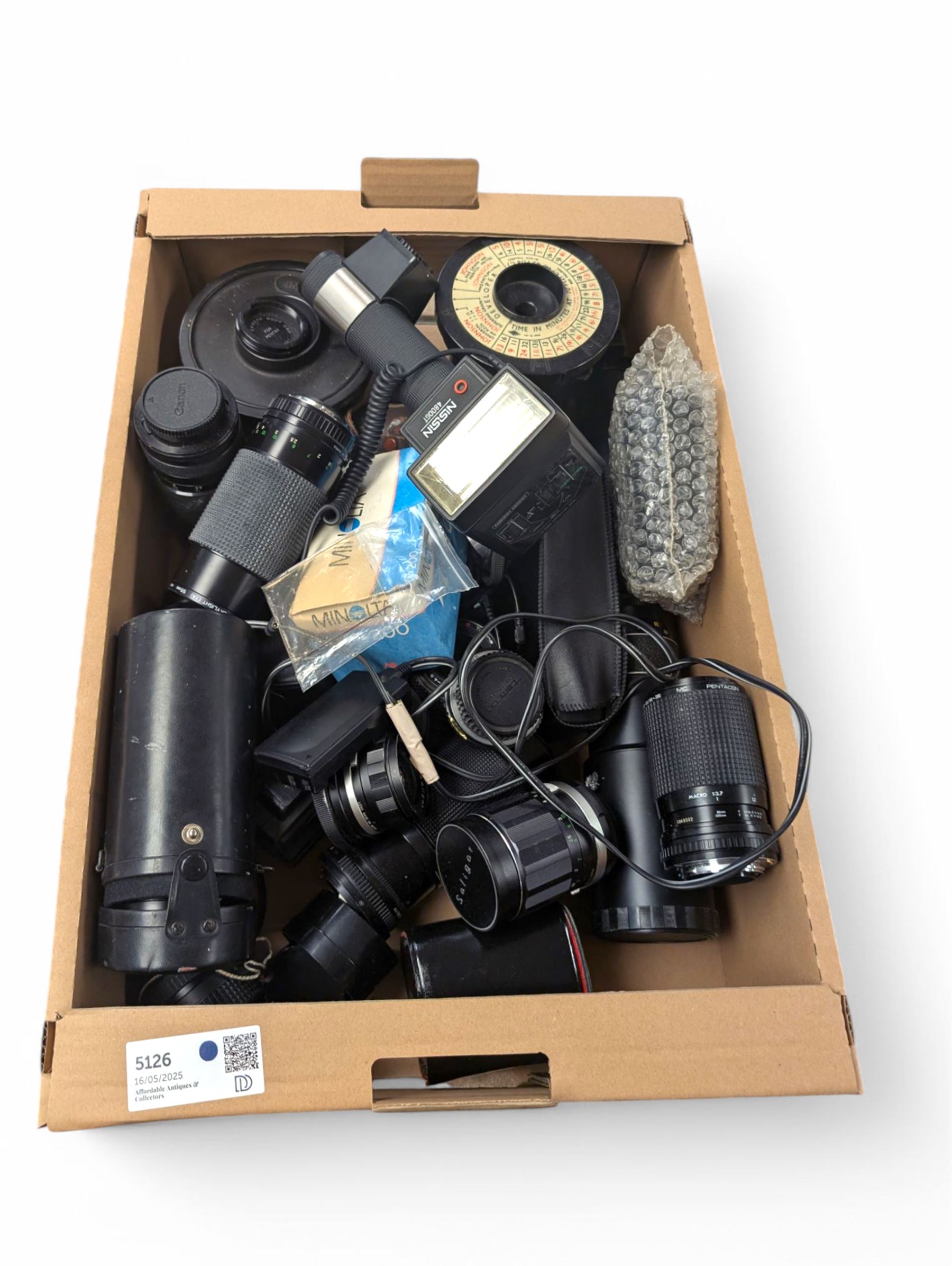 Collection of camera lenses, including Tamron, Praktica, Minolta and Soligor examples