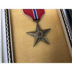 American Purple Heart Medal awarded to 32634848 Charles H. Poppo; cased with identity tags and paperwork; and Bronze Star Medal awarded to U.S. Marine Esteban T. Maranao; cased; American WWII Victory Medal and Asiatic Pacific Campaign Medal