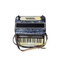 Parrot- Chinese accordion, with 30 treble keys and 24 bass buttons, 14 fold bellows. In a velvet lined hard case.
