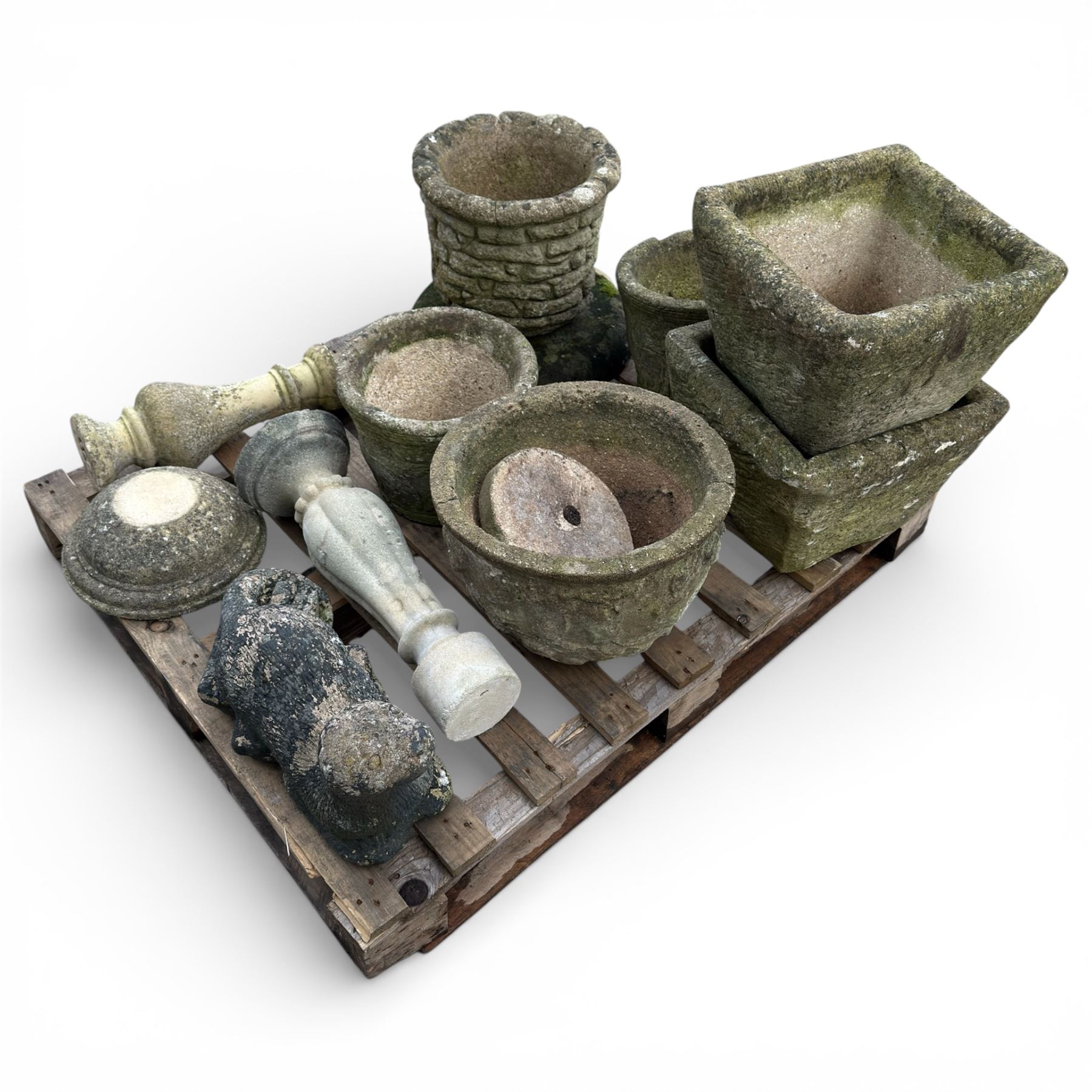 Collection of various cast stone planters and other stone items