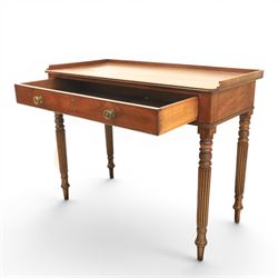 Early 19th century mahogany dressing table, rectangular top with three quarter gallery, frieze drawer with two brass knobs, stamped 'Gillow', raised on turned and reeded supports 