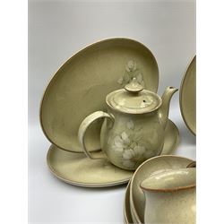 Denby tea and dinner ware decorated in the Daybreak pattern, comprising of tea pot, two jugs, seven cups and six saucers, salt and pepper shakers, four oval platters, six side plates, starter plates, dinner plates and bowls.
