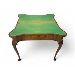 Georgian walnut fold-over card table, shaped rectangular top opening to reveal a baize-lined surface, supported by a concertina pull-out rear mechanism, frieze fitted with single drawer, raised on cabriole supports with foliate carvings terminating in pad feet