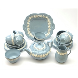 A Wedgwood Queensware tea service, comprising teapot, milk jug, open sucrier, eight teacups, six saucers, six side plates, and a serving plate, each marked beneath. 