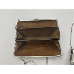 Early 20th century silver mounted coin purse, with leather interior and finger chain, hallmarked Samuel M Levi, Birmingham 1917, together with a similar Edwardian example, with engraved initials and engine turned decoration, hallmarked Birmingham 1907, maker's mark worn and indistinct, largest W11.3cm