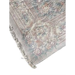 Chinese washed woollen pale ground carpet with overall floral design 