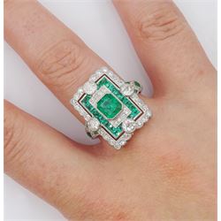 Platinum milgrain set emerald and diamond ring, the central octagonal cut emerald with calibre cut emeralds, old and single cut diamond surround, with World Gemological Institute Report