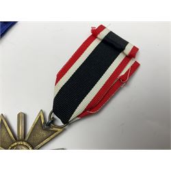 WWII German 'SS' Long Service Medal for four years; Ostfront Medal for the Winter Campaign in Russia of 1941-1942 'Die Medaille Winterschlacht Im Osten'; and War Merit Cross 2nd Class with swords; all with ribbons (3)