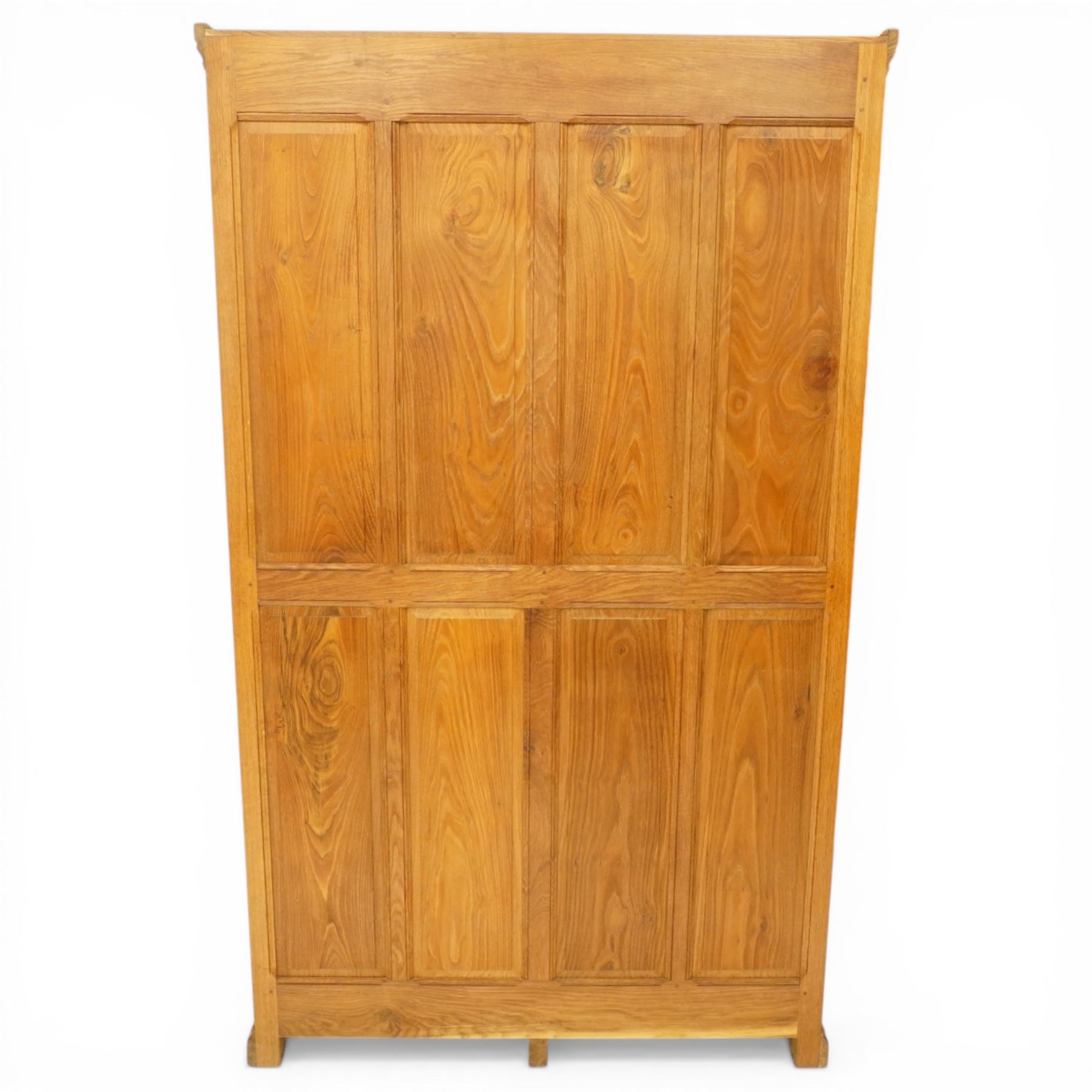 Beaverman - Yorkshire oak panelled double wardrobe, with carved pediment, panelled doors and sides, with internal top shelf above a single hanging rail, with carved beaver signature, by Colin Almack of Sutton near Thirsk