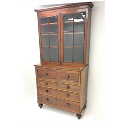  19th century mahogany secretaire bookcase, projecting cornice above two glazed doors enclosing three shelves, single fall front drawer enclosing fitted interior above three drawers, turned supports, W111cm, H197cm, D50cm  