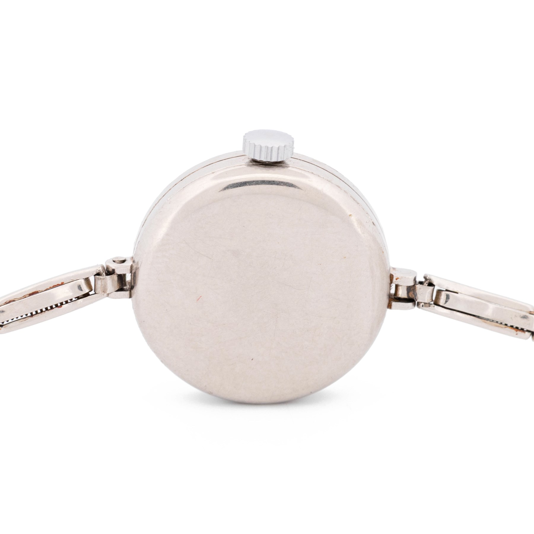 Audemars Piguet & Co Art Deco ladies platinum, diamond set manual wind wristwatch, movement No. 19931, cream / silvered dial with Arabic hour markers, the bezel milgrain set with round cut diamonds, to a platinum expanding bracelet