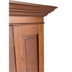 Edwardian walnut single wardrobe, projecting cornice over panelled front and bevelled mirror glazed door, single drawer to base