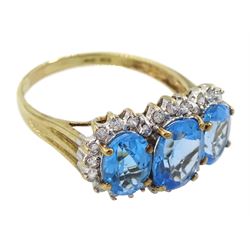 9ct gold three stone oval blue topaz and diamond cluster ring