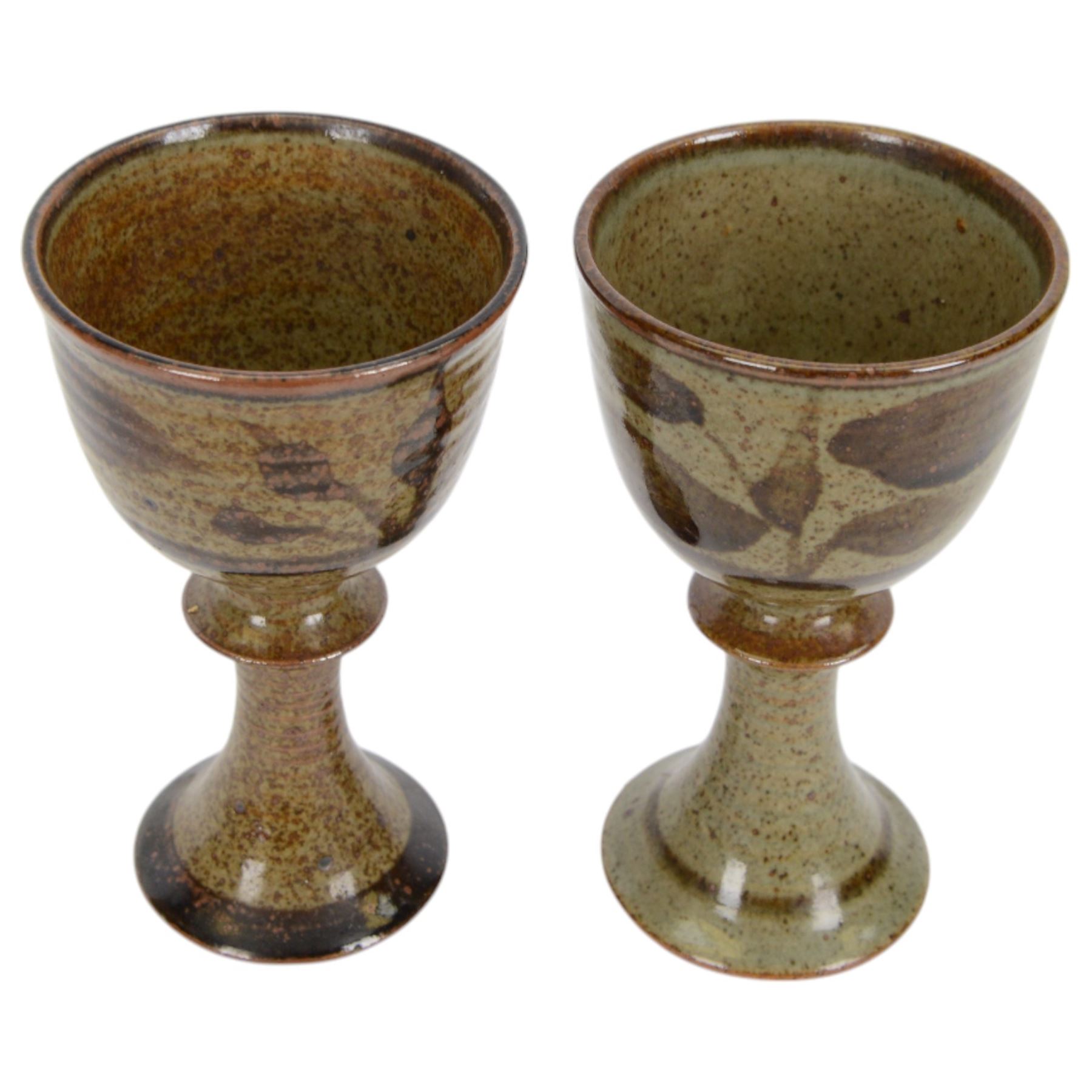 David Lloyd Jones (1928-1994): set of four studio pottery goblets, with foliate decoration on a mottled brown ground, together with two small stoneware bowls by the same artist, with stylised bird border on an orange brown ground, all with impressed marks beneath, goblets H15.5cm