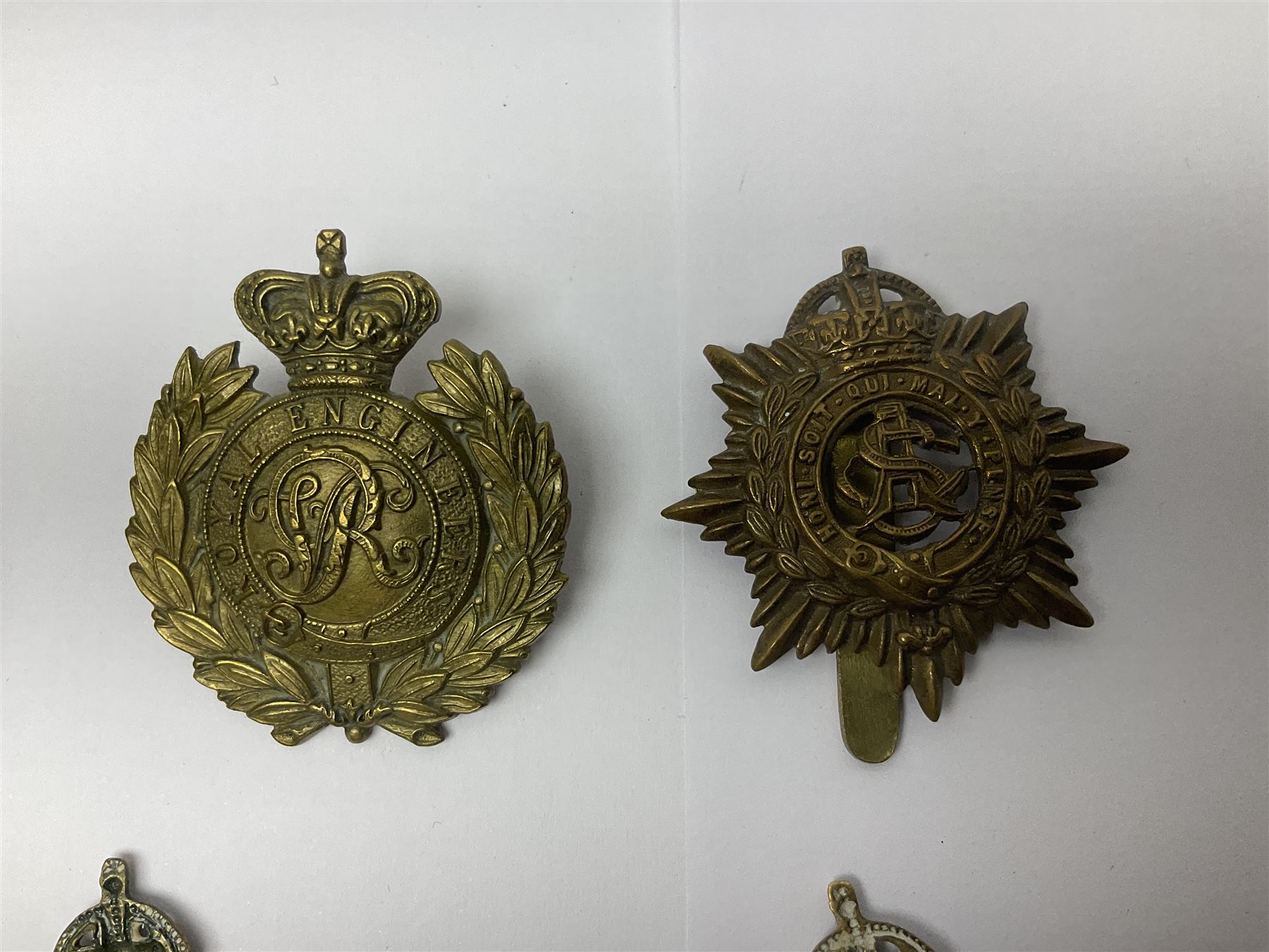 Twelve cap badges including Royal Artillery, 3rd RGA Middlesex Volunteers, Hon. Artillery Company, West Riding and Waraickshire Royal Horse Artillery, Royal Engineers and Army Service Corps (12)
