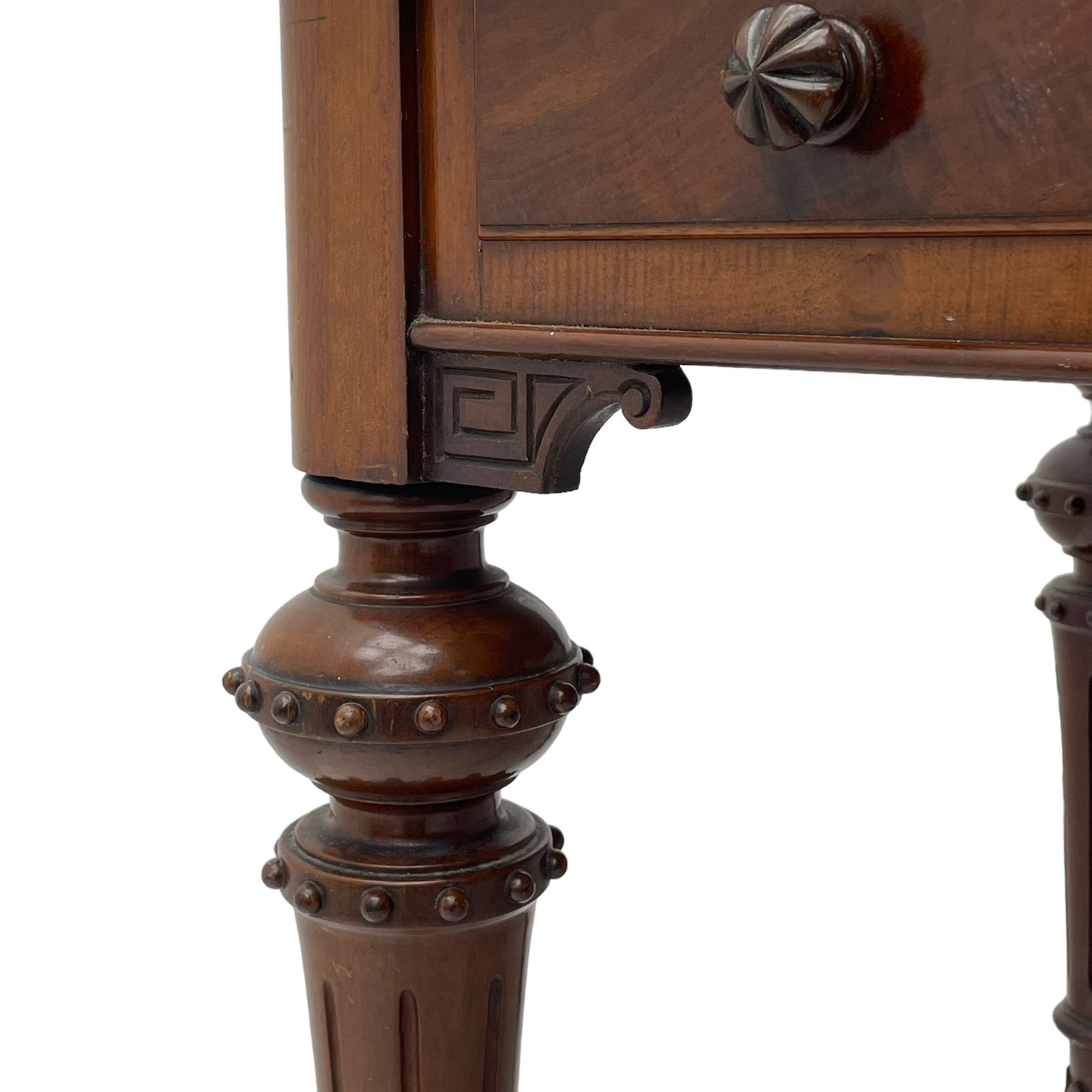 Victorian figured mahogany two-piece bedroom set - the washstand with white and black marble moulded top with arched back and raised shelf, two moulded frieze drawers, on turned and fluted supports with brass and ceramic castors (W123cm, D60cm, H102cm); the dressing table with raised swing mirror in moulded frame with shell and scroll carved pediment, on scrolled horns carved with foliage, four raised trinket drawers over moulded rectangular top, fitted with two drawers, on turned and fluted supports with brass and ceramic castors (W122cm, H177cm, D62cm)