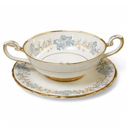 Tuscan Avondale dinner and coffee service for twelve covers with a blue and gilt border pattern comprising  twelve dinner plates, twelve dessert plates, twelve side plates, twelve two handled soup bowls and stands, four vegetable dishes and covers,  four graduated meat plates, sauce boat and stand, twelve coffee cups and saucers and twelve tea plates (106)