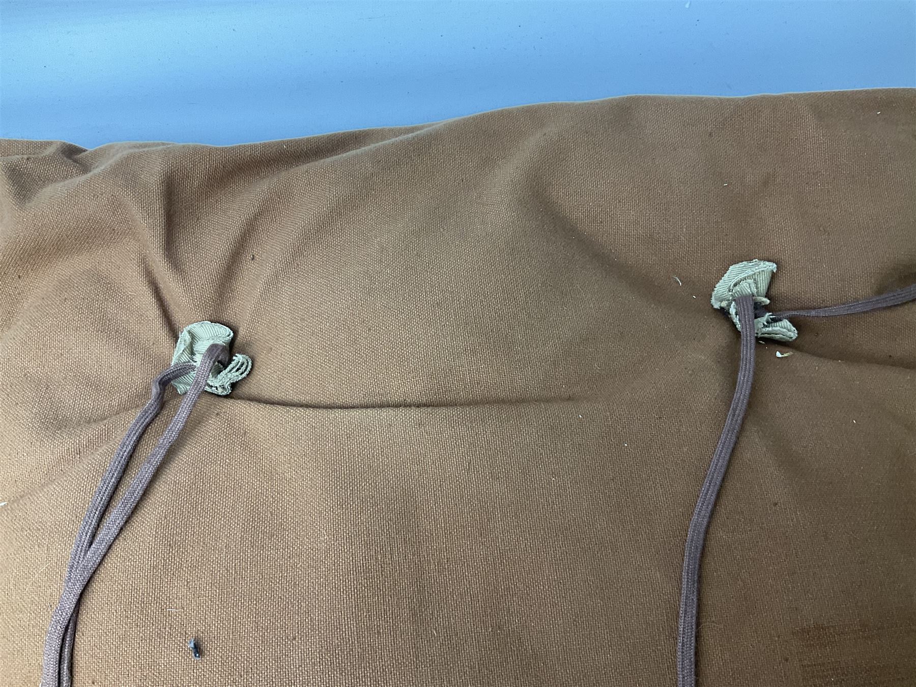 WW2 British Army RAMC 'Regimental Medical Pannier', well marked externally and dated 1941, stamped May 1943 internally, canvas covered wicker form with leather edges, hinged top and fall front with two rope carrying handles, fitted iron locking straps with securing chains; contains various unused field dressings and bandages with WW2 dates and two pillows; original label under lid L79cm