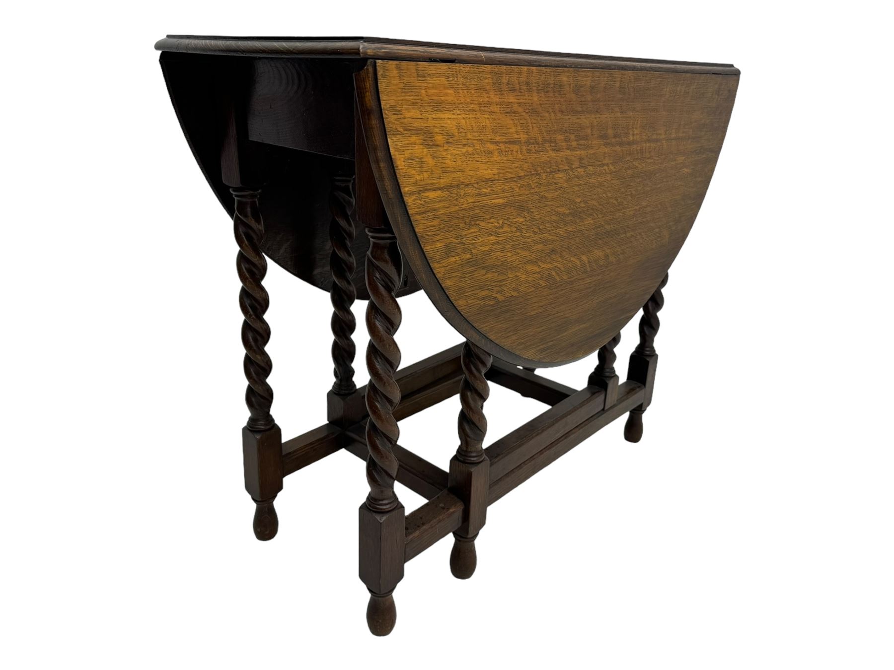 Early 20th century oak gateleg table, oval top with drop leaves supported by barley twist swing supports, united by plain stretchers, on turned feet (W119cm, D92cm, H77cm);