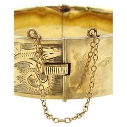 9ct gold hinged bangle with bright cut decoration by Henry Griffith & Sons Ltd, Birmingham