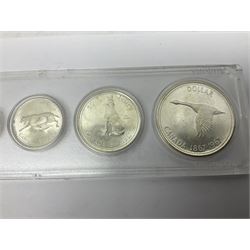 South Africa 1897 one shilling, 1967 one rand, Ireland 1928 two shillings and sixpence, Netherlands 1930 two and a half gulden, two Queen Elizabeth II Canada one dollar coins dated 1958 and 1964, 1967 six coin set in plastic holder etc