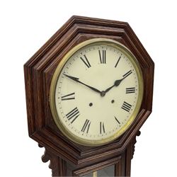 American - late 19th century 8-day drop dial wall clock, with a 12” dial and moulded hexagonal dial bezel, painted dial with roman numerals, minute track, steel spade hands and spun brass bezel, with a glazed case door and visible pendulum, eight-day spring driven movement striking the hours and half-hours on a coiled gong. With key.