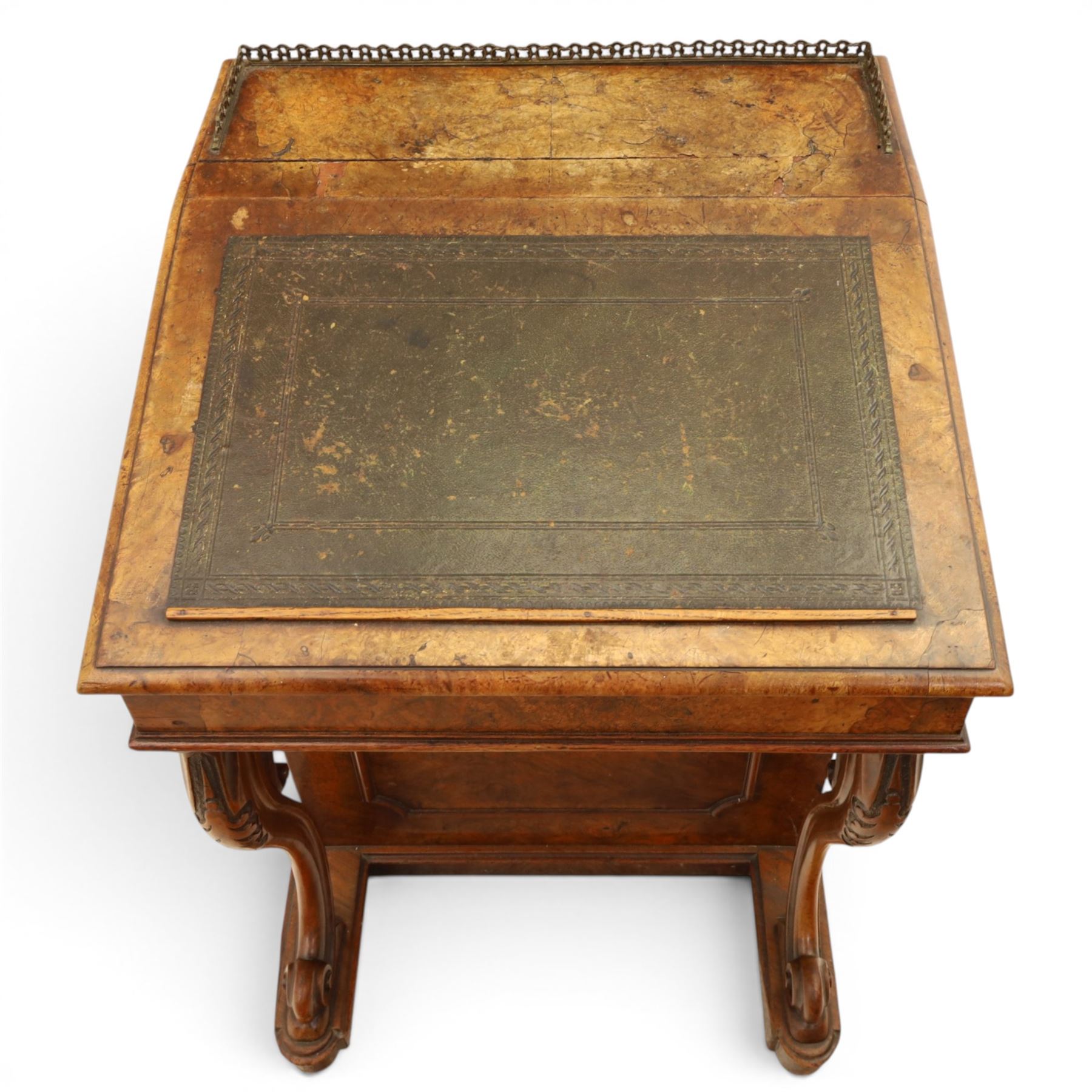 Victorian figured walnut Davenport, the fixed fall with drawer to the side enclosing writing compartment, green tooled leather writing inset, galleried back rail, right side fitted with four drawers behind a panel, opposing panelled side, raised on carved cabriole front supports with scroll terminals and platform base