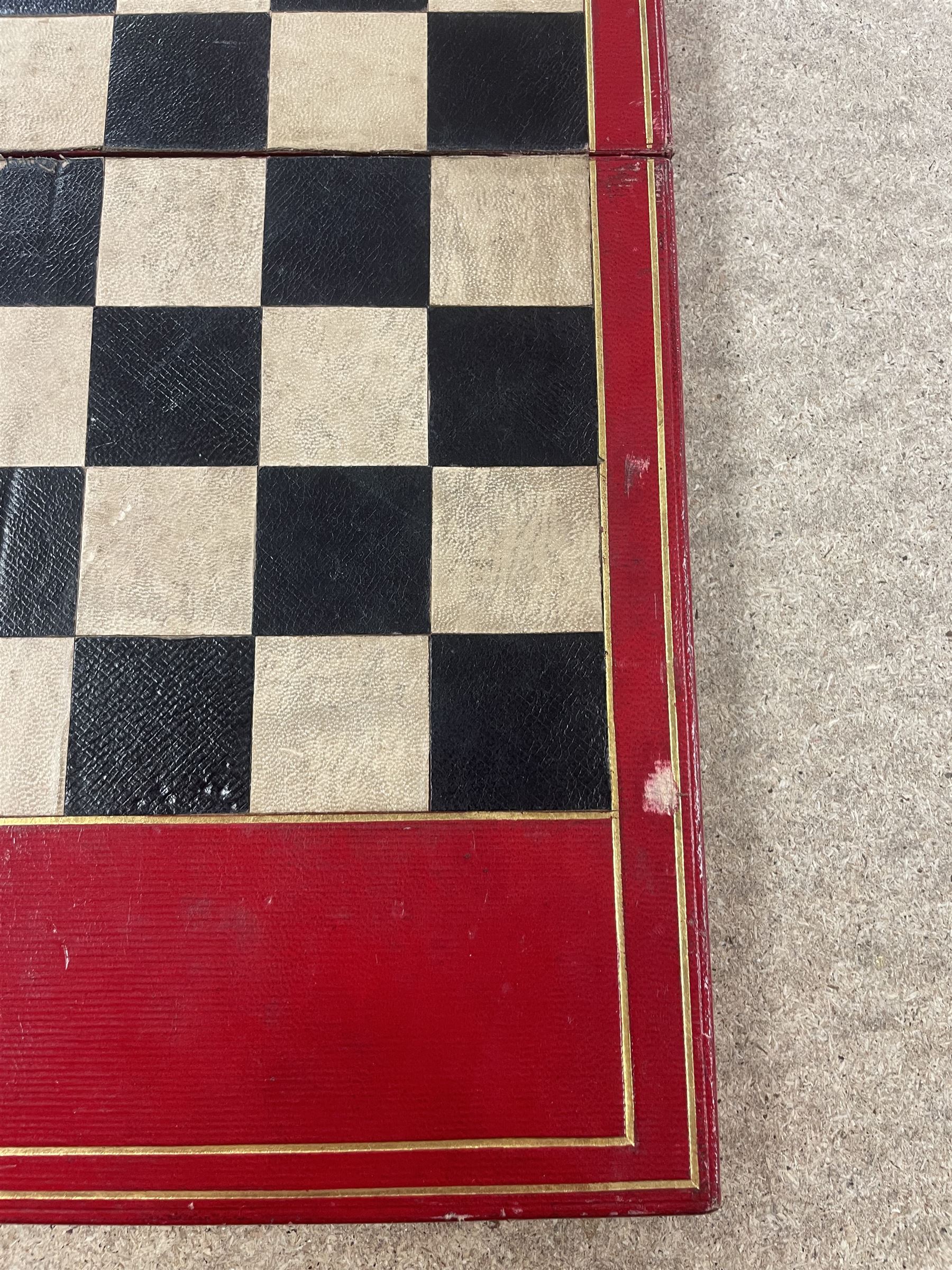 19th century walnut and brass bound games compendium box, painted to enhance the grain, of rectangular form, the hinged opening cover with rounded sides, central brass cartouche with engraved lion crest, and brass riveted straps, opening to reveal a red leather and blue silk lined compartmented interior, with fold-down games board, and lift-out tray containing playing cards, ebony turned dice towers, white and red stained bone draughts, and chess pieces, ivory dice, and ivory and ebony whist markers, and brass bezique board, cribbage board and markers, H15cm W32cm D24cm
This lot has been registered for sale under Section 10 of the APHA Ivory Act