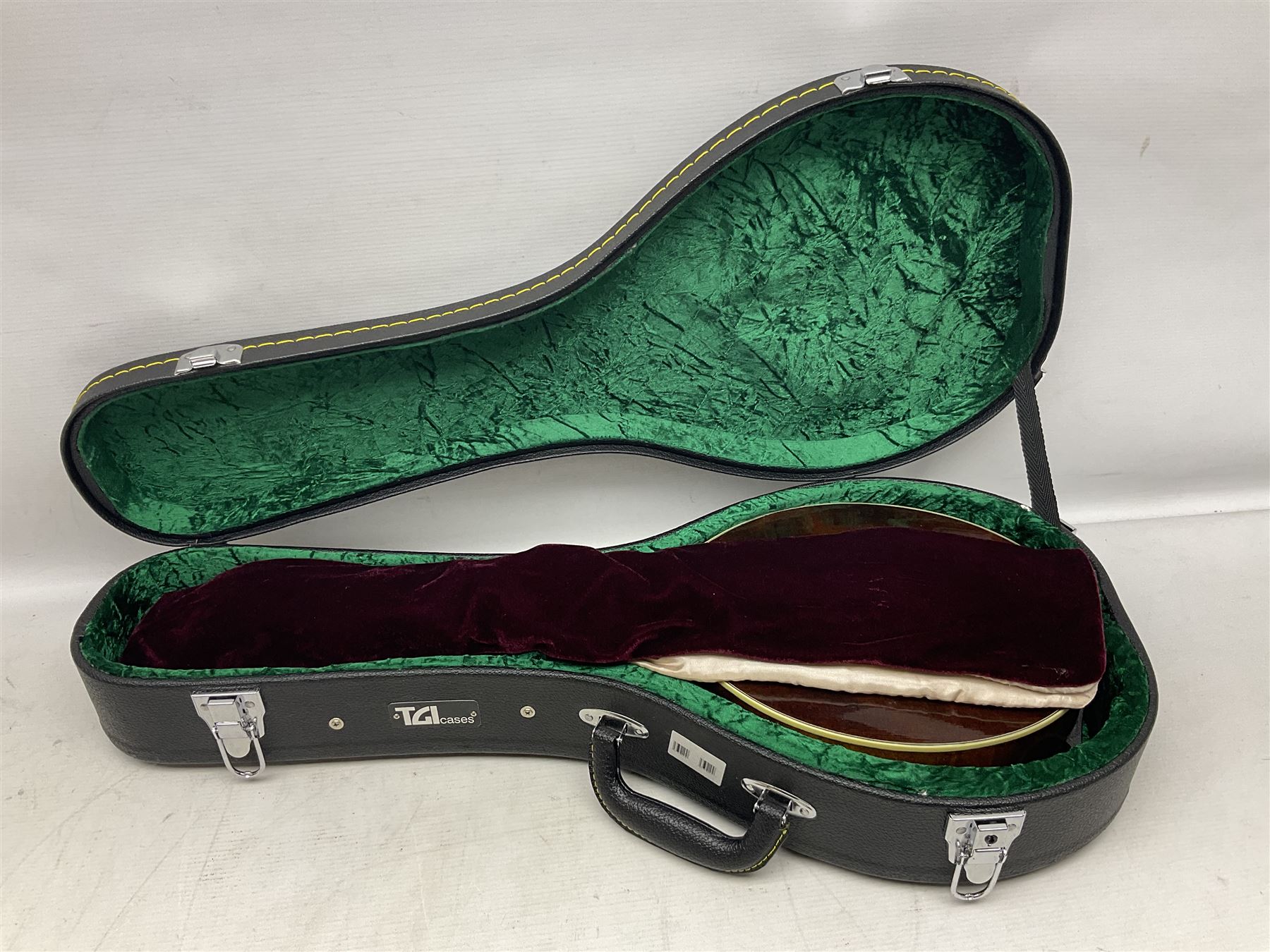 Eastman eight-string mandolin model MD504, serial no.140435406, L66cm; in TGI hard carrying case; together with case of instructional CDs