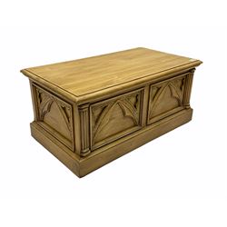 Polished pine blanket box, hinged top, carved front