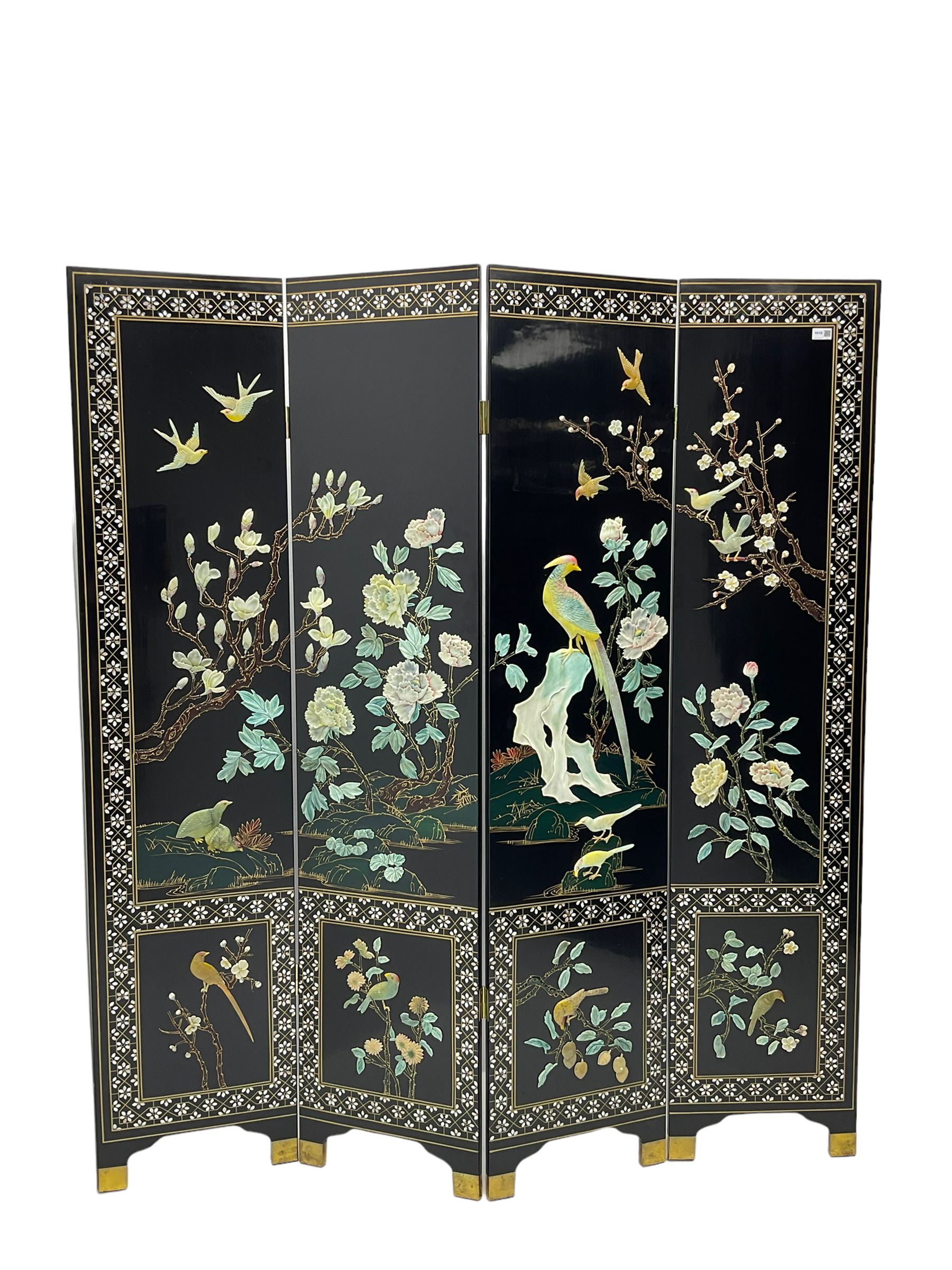 Japanese Shibayama style black lacquered four panel folding screen, naturalist scenes of trailing branch and blossom flowers, decorated with with birds, floral mother of pearl inlaid borders