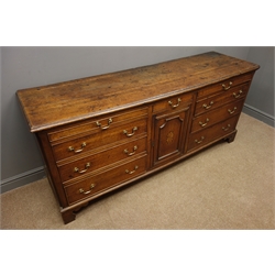 George III Lancashire oak dresser base, moulded top above nine drawers and cupboard door inlaid with fan, on bracket feet, W186cm, H81cm, D52cm  