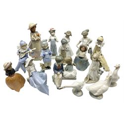 Fourteen Nao figures, to include First Love, Girl with puppies, geese, etc, together with a Lladro goose