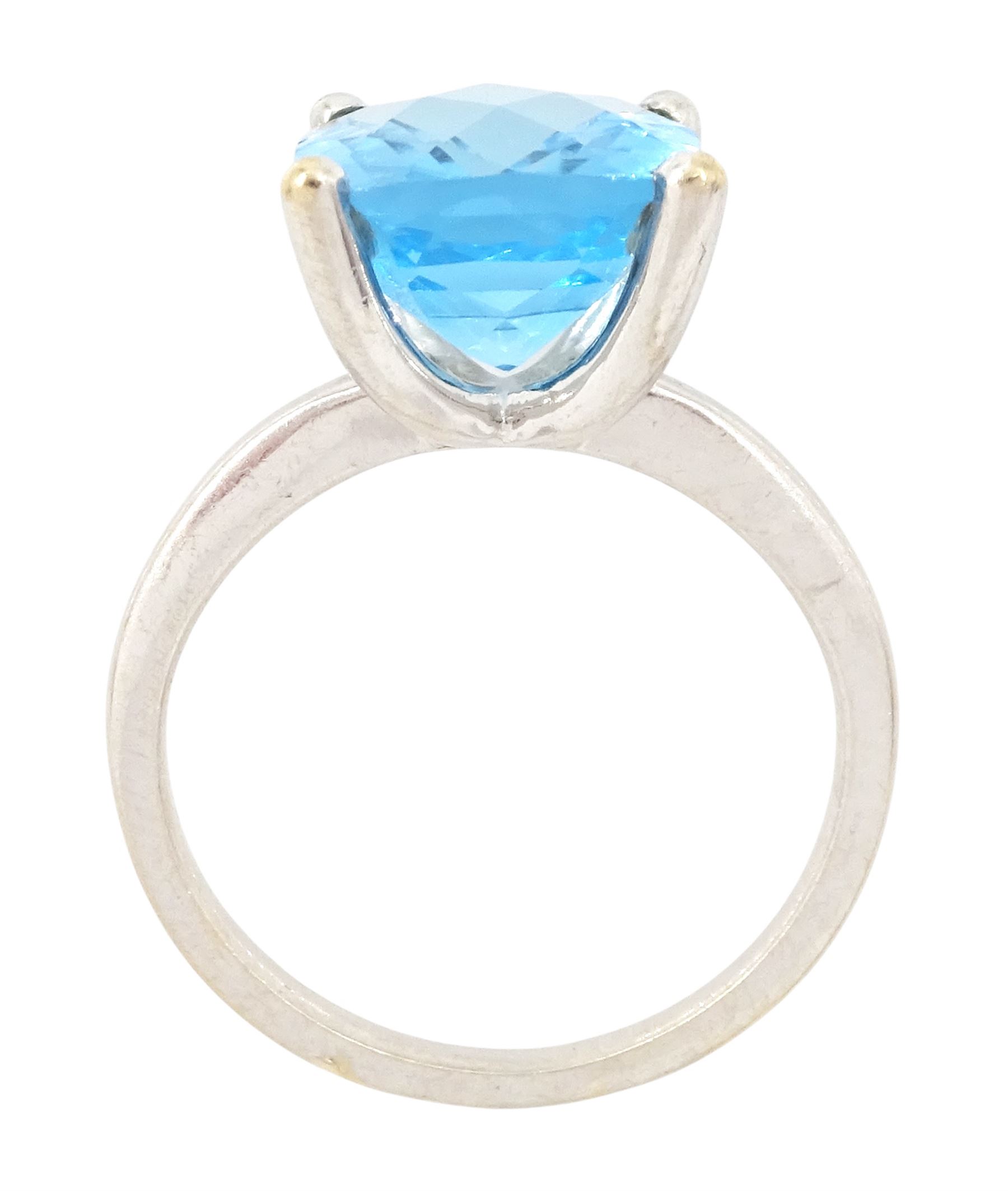 18ct white gold blue topaz ring, four claw set with a single cushion briolette cut Swiss blue topaz, hallmarked