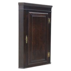 George III country oak corner cupboard, enclosed by single cushion panelled door, brass H hinges