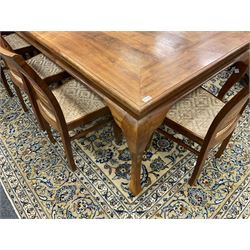 Large teak dining table, moulded rectangular top, on cabriole supports, together with a set of ten ladder back dining chairs with cane work seats