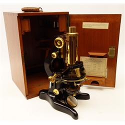  20th century black japanned & lacquered brass monocular 'Patna' Microscope, outfit 16603, stamped W.Watson & Sons Ltd. London No.71476, with rack & pinion coarse and fine adjust, three objective turret on horse shoe base, in fitted mahogany case with additional objective, filters etc, with original receipt for 1940, H32cm, case H42cm    
