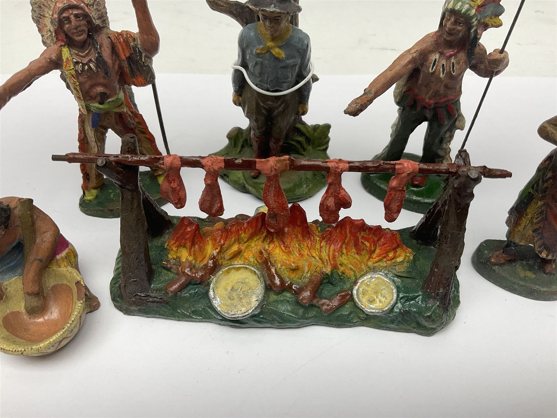 Five Elastolin American Indian figures, together with an Elastolin campfire and a cowboy tied to a tree, tallest H11cm