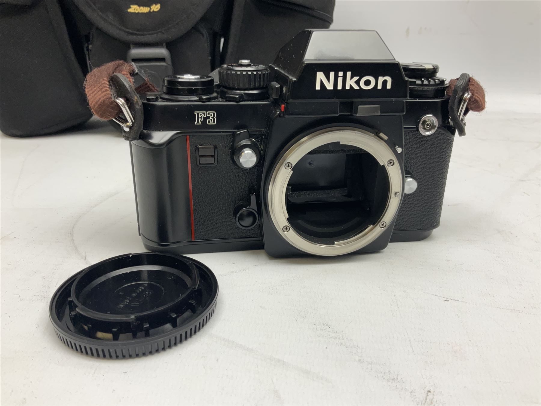 Nikon F3 SLR camera, serial number 1583609; Nikon 50mm 1:1.8 lens; Nikon 28-85mm 1:3.5-4.5 zoom lens; Vivitar MC 2X-3 Tele Converter, and a Nikon Speedlight SB-16 flash