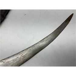 Late 19th/20th century Middle Eastern jambiya dagger the 36cm broad curved double edged steel blade with traces of script, horn and copper backed waisted white metal hilt with three roundel buttons; in ornate white metal and leather mounted brass and steel scabbard L60.5cm overall
