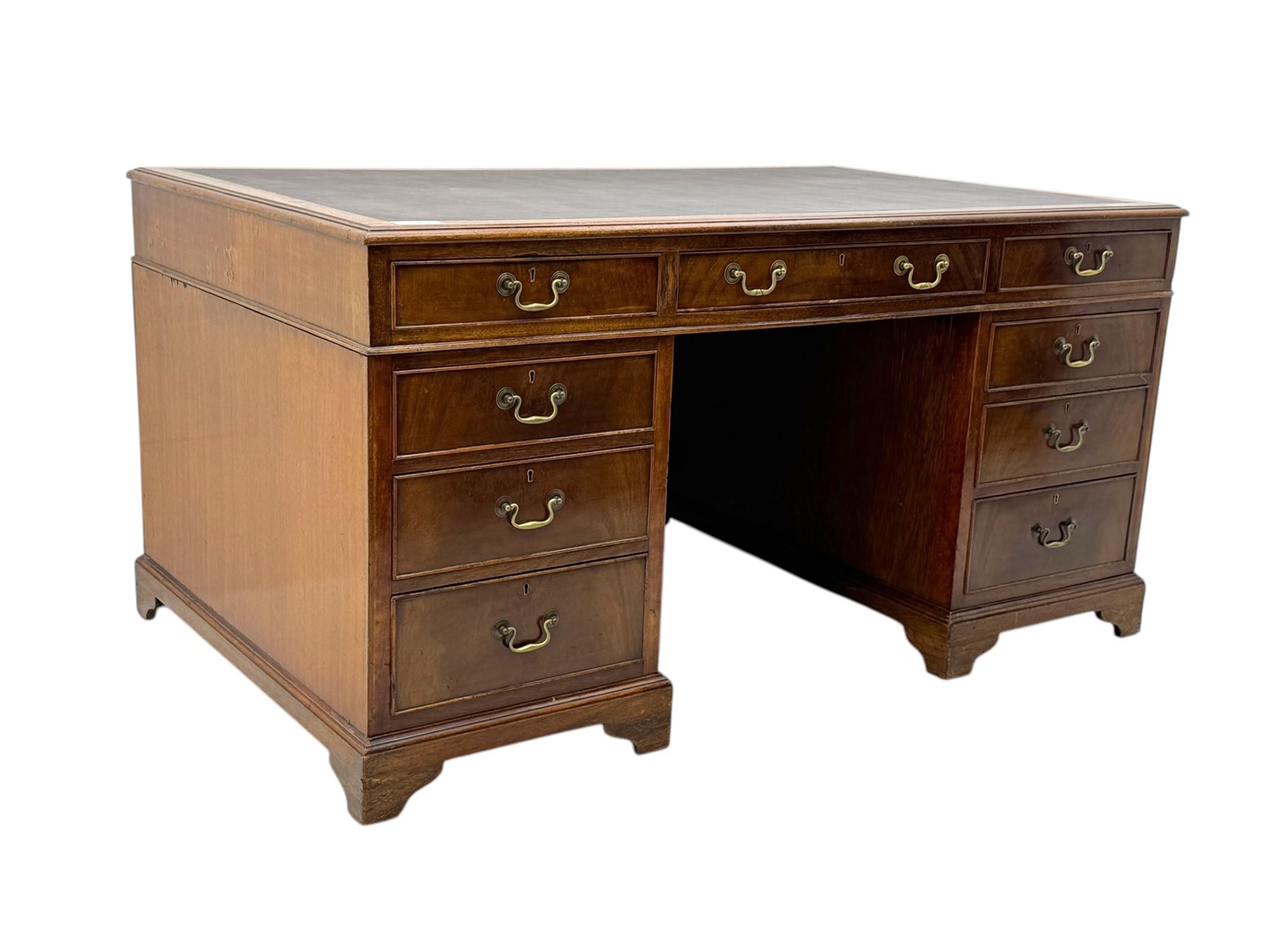 Edwardian mahogany twin pedestal desk, rectangular burgundy leather top moulded edge, over three short drawers with brass swan neck handles, over twin pedestals with graduating drawers supported on bracket feet